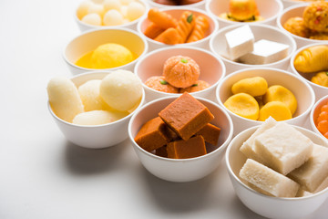 Rangoli of Assorted Indian sweets/mithai in bowl for Diwali or any other festivals, selective focus