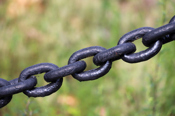 Closeup of an old black chain