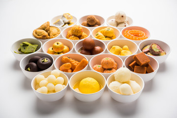 Rangoli of Assorted Indian sweets/mithai in bowl for Diwali or any other festivals, selective focus