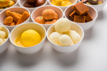 Rangoli of Assorted Indian sweets/mithai in bowl for Diwali or any other festivals, selective focus