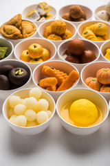 Rangoli of Assorted Indian sweets/mithai in bowl for Diwali or any other festivals, selective focus