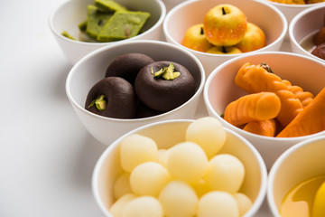 Rangoli of Assorted Indian sweets/mithai in bowl for Diwali or any other festivals, selective focus