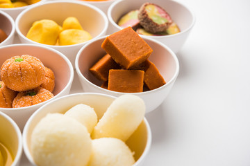 Rangoli of Assorted Indian sweets/mithai in bowl for Diwali or any other festivals, selective focus