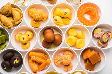 Rangoli of Assorted Indian sweets/mithai in bowl for Diwali or any other festivals, selective focus