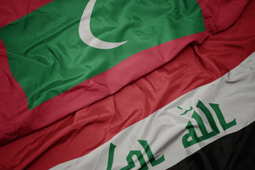 waving colorful flag of iraq and national flag of maldives.