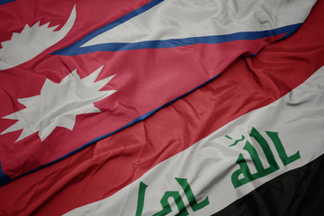 waving colorful flag of iraq and national flag of nepal.