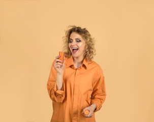 Enjoying healthy food. Beautiful girl eating carrot. Vegetable having good impact on teeth. Smiling...