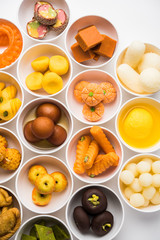 Rangoli of Assorted Indian sweets/mithai in bowl for Diwali or any other festivals, selective focus