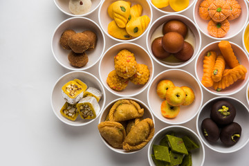 Rangoli of Assorted Indian sweets/mithai in bowl for Diwali or any other festivals, selective focus