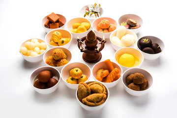 Rangoli of Assorted Indian sweets/mithai in bowl for Diwali or any other festivals, selective focus