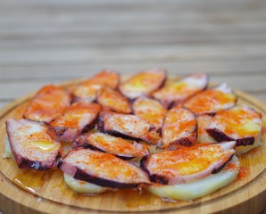 Sliced octopus grill with pimento paprika powder and potato