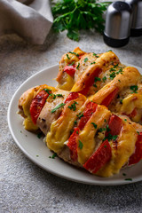 Baked chicken breasts with cheese and tomato