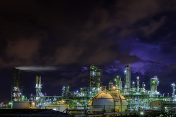 Fototapeta na wymiar Glitter lighting of petrochemical industrial plant at night, Manufacturing of petroleum industry, Oil and gas refinery industrial plant on night sky background