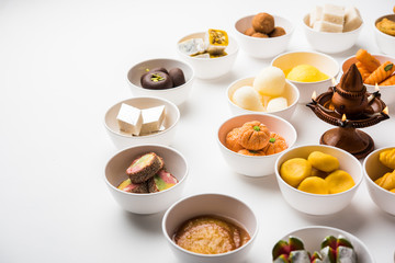 Rangoli of Assorted Indian sweets/mithai in bowl for Diwali or any other festivals, selective focus