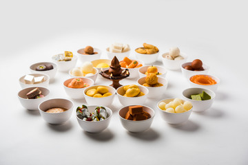 Rangoli of Assorted Indian sweets/mithai in bowl for Diwali or any other festivals, selective focus