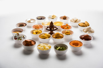 Rangoli of Assorted Indian sweets/mithai in bowl for Diwali or any other festivals, selective focus