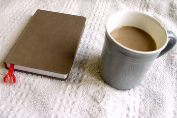 cocoa and notebook with pen background on towel