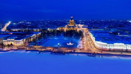 Fototapeta premium Winter in Russia. Evening Petersburg. Panorama of the city from a height. Sights Of St. Petersburg. Isaakievsky cathedral. Bronze horseman. Neva embankment. Visit card of the city.