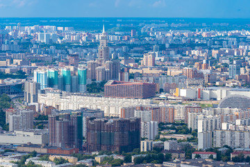 Fototapeta na wymiar Russia. View of Moscow from a height. Houses and offices in the center of the capital. Urban landscape. Urban architecture. Modern city. Lots of different buildings.