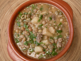  pigeon peas on a brown bowl cooked with pork and curry