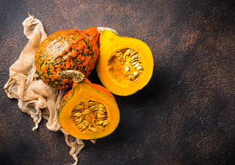 Dissected raw hokkaido pumpkin with seeds