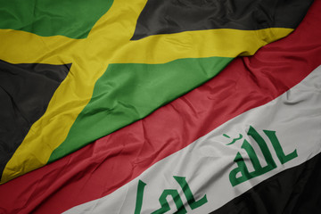 waving colorful flag of iraq and national flag of jamaica.