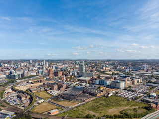 Aerial photo of the British town of Leeds in West Yorkshire UK, showing the Leeds City Centre taken with with a drone on a bright sunny day in the town of Holbeck near to the centre.