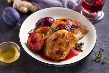 Chicken thighs and plums in ginger, honey and red wine sauce with thyme. Dish ingredients on the table