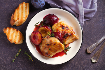 Chicken thighs and plums in ginger, honey and red wine sauce with thyme