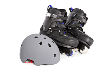 Close up of aggressive inline skates and a helmet