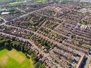 Aerial photo of the town known as Beeston in Leeds West Yorkshire UK, showing a rows of houses in a...