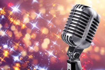 Retro style microphone on abstract background