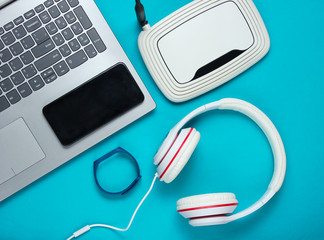 Modern digital gadgets and accessories. Laptop, smartphone, smart bracelet, headphones, wi-fi...