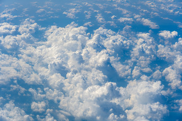 White clouds and sky, a view from airplane window
