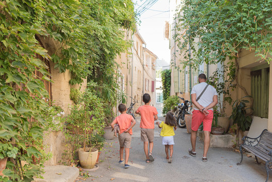 Fototapeta Beautiful streets of the village of Cucuron, in the Luberon, France. All its doors and windows are painted with pastel colors.