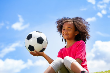 Beautiful black girl portrait with football ball - Powered by Adobe
