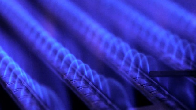 Burning of natural gas inside of boiler furnace