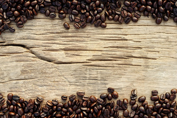 roasted coffee beans on wood background.with copy space