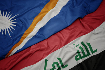 waving colorful flag of iraq and national flag of Marshall Islands .