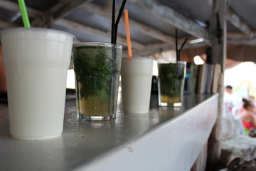 Mojito and milkshake at the bar. Refreshment. Drinks on vacation with children.