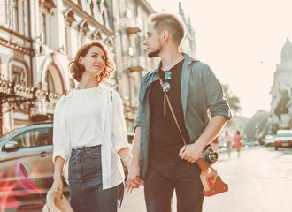 Obraz premium Romantic youth concept. Young stylish hipster couple in love at the city.