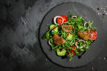 healthy salad chicken liver, mix leaves, vegetables. healthy food (arugula, mix salad, tomato, onion, cucumber) menu concept. food background. copy space. Top view