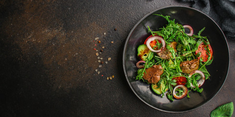 healthy salad chicken liver, mix leaves, vegetables. healthy food (arugula, mix salad, tomato, onion, cucumber) menu concept. food background. copy space. Top view