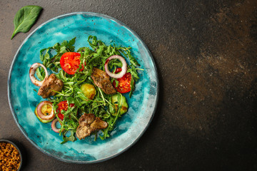 healthy salad chicken liver, mix leaves, vegetables. healthy food (arugula, mix salad, tomato, onion, cucumber) menu concept. food background. copy space. Top view