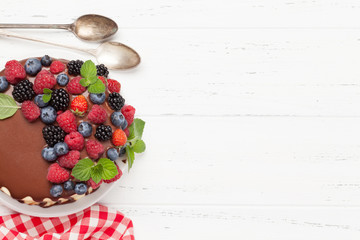 Naklejka na ściany i meble Cheesecake with berries and chocolate