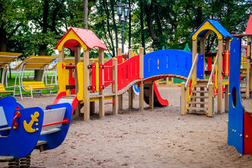 Fototapeta na wymiar City playground. Children's entertainment. Slides and swings.