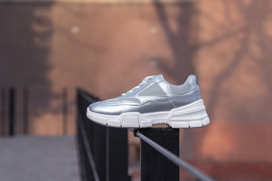 Silver sneakers for girl . Woman shoes . Street shoes 