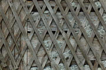 Old gray diagonal wooden grate