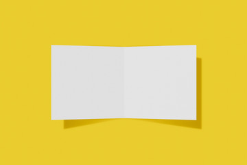 Mockup square booklet, brochure, invitation isolated on a yellow background with hard cover and realistic shadow. 3D rendering.
