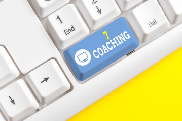 Text sign showing 7 Coaching. Business photo showcasing Refers to a number of figures regarding business to be succesful White pc keyboard with empty note paper above white background key copy space